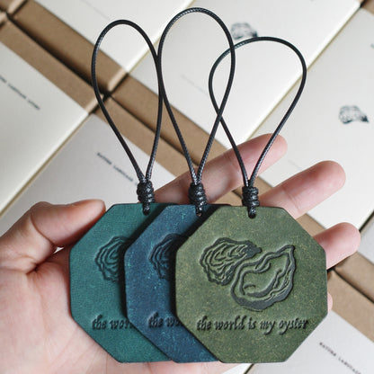 "The World Is My Oyster" Leather Charm