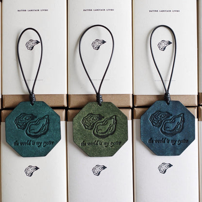 "The World Is My Oyster" Leather Charm